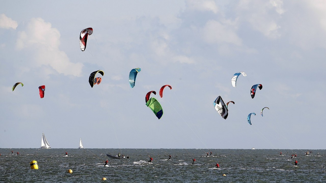 Kitesurfers attempt the Guinness World Record for the most kitesurfers on the water at one time at the Virgin Kitesurfing Armada 2014 at Hayling Island, Hampshire