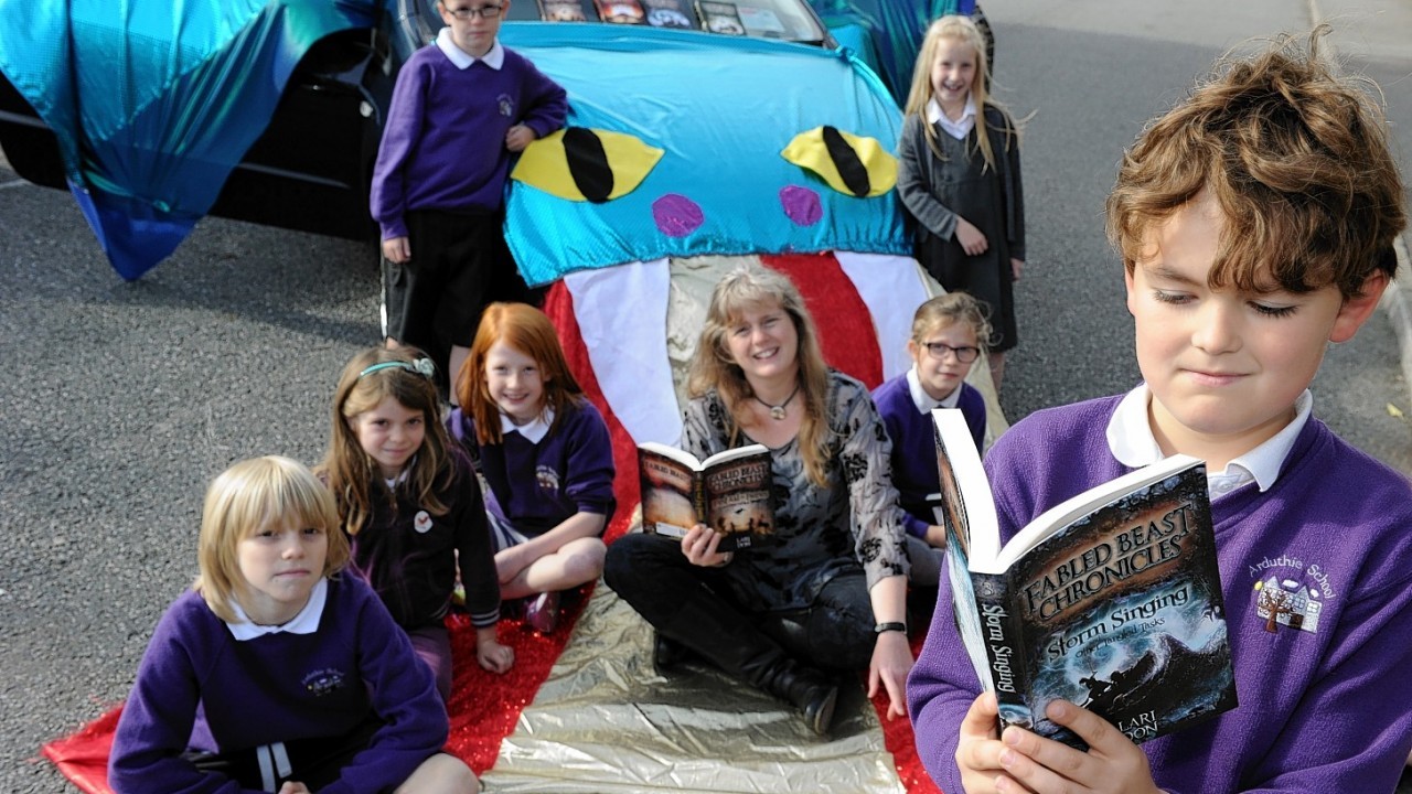 Award winning children's author Lori Don, originally from Dufftown, is on a national book tour visiting schools with her dragon car