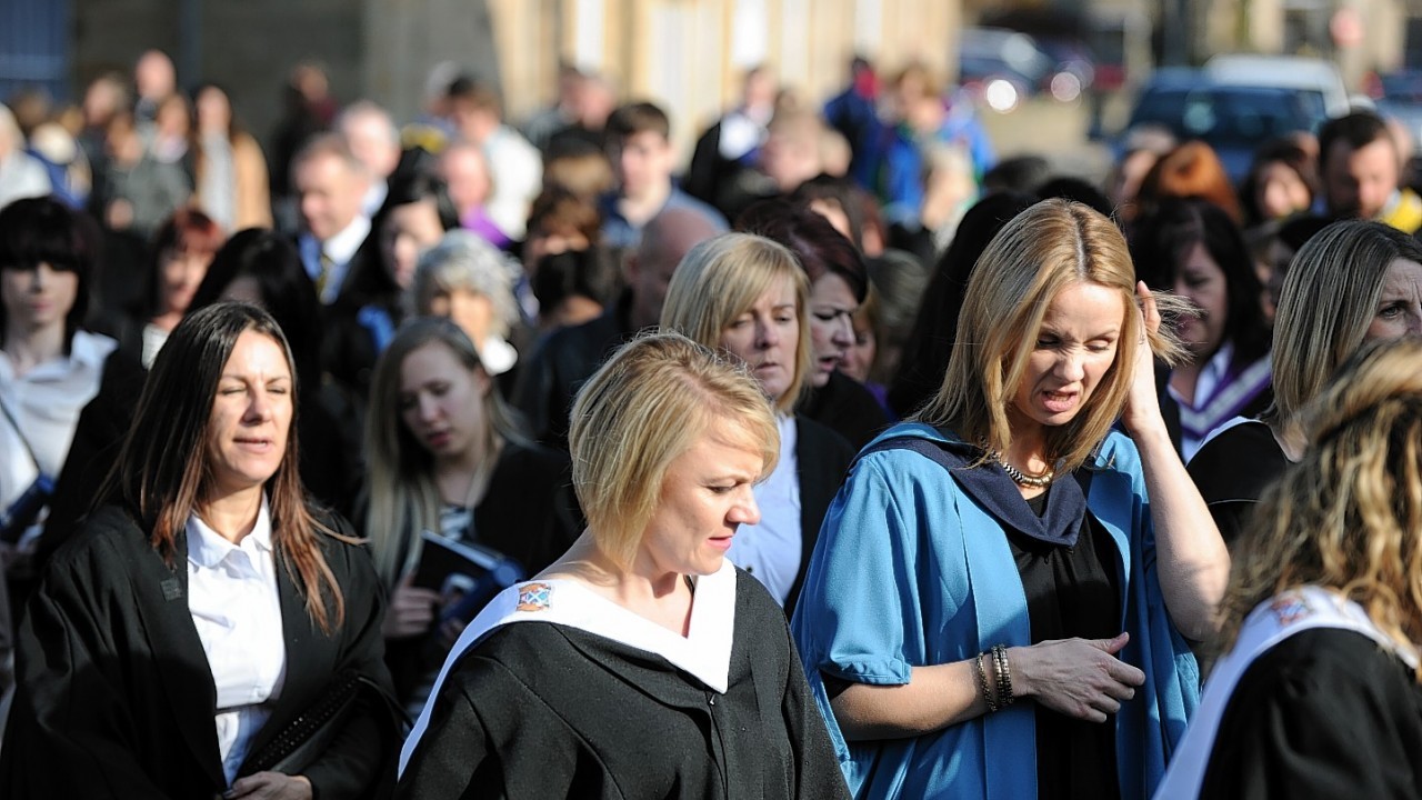 Graduates parade from St. Giles Church, High Street, Elgin, to the college after the ceremony