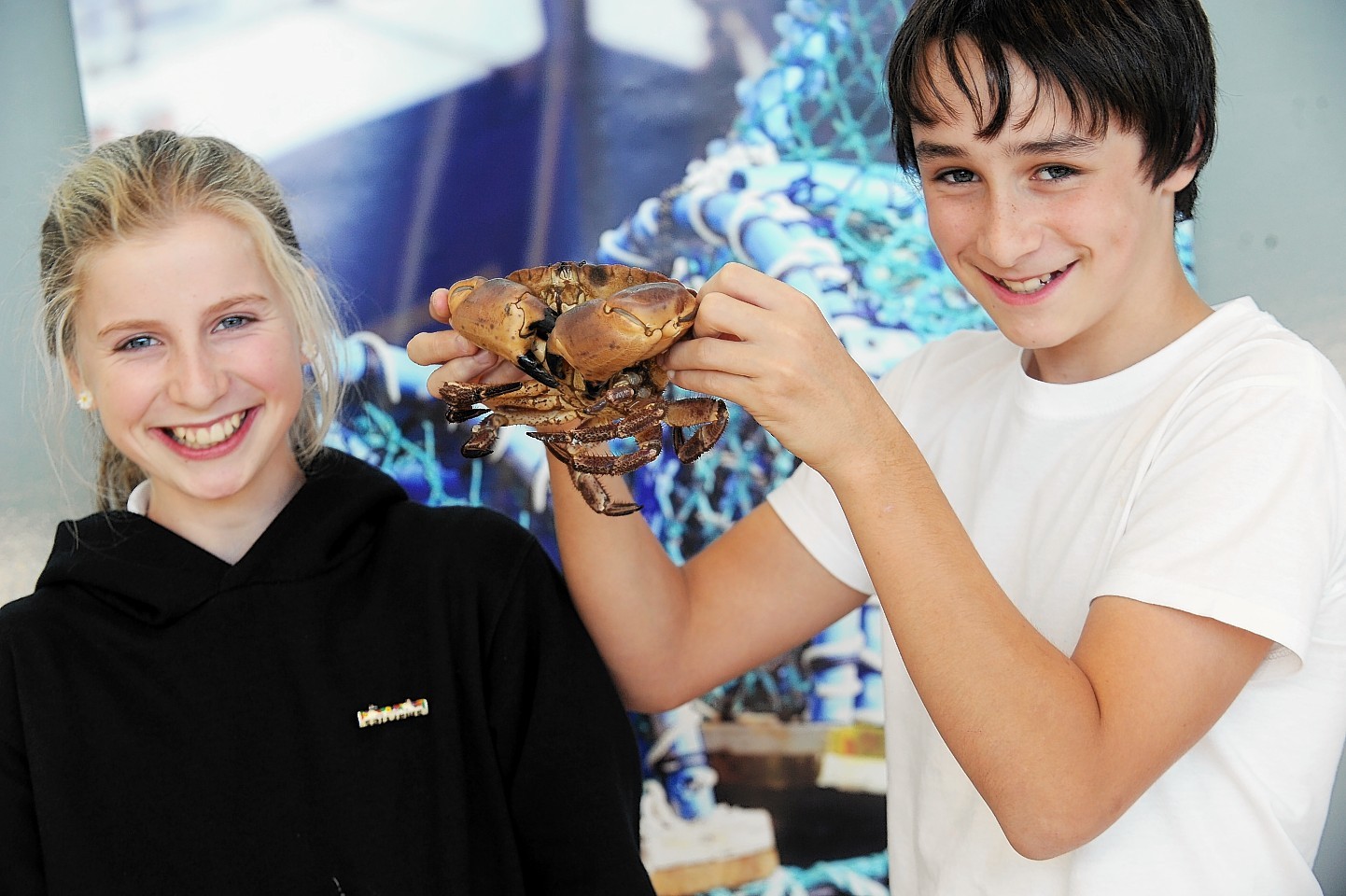 Fortrose Academy pupils Sarah Holden and James Thomson, both aged 12, with some of the seafood on show