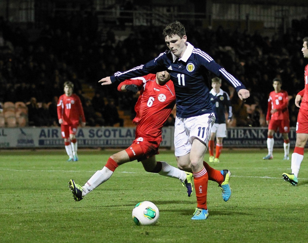 Andrew Robertson: This defence is completed by another who has only recently made the step up from the youths - here is Robertson taking on Georgia at under-21 level in 2013