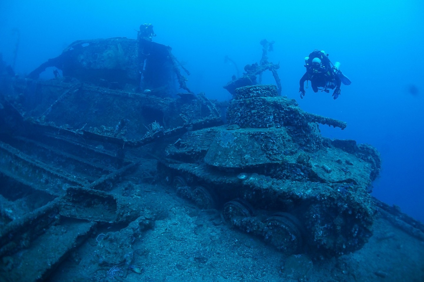 The divers survey the Japanese shipwrecks