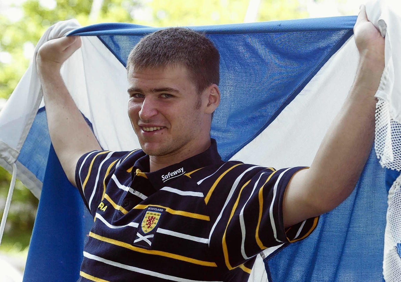 Davis Marshall flies the Saltire ahead of an under-21s match in 2004