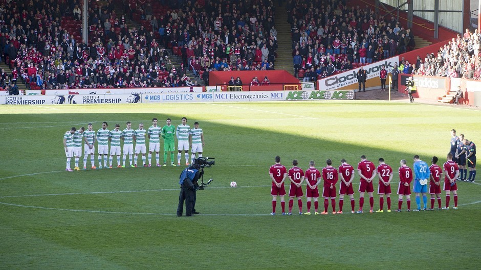 Aberdeen and Celtic players stand for the minute's silence for Remembrance Sunday