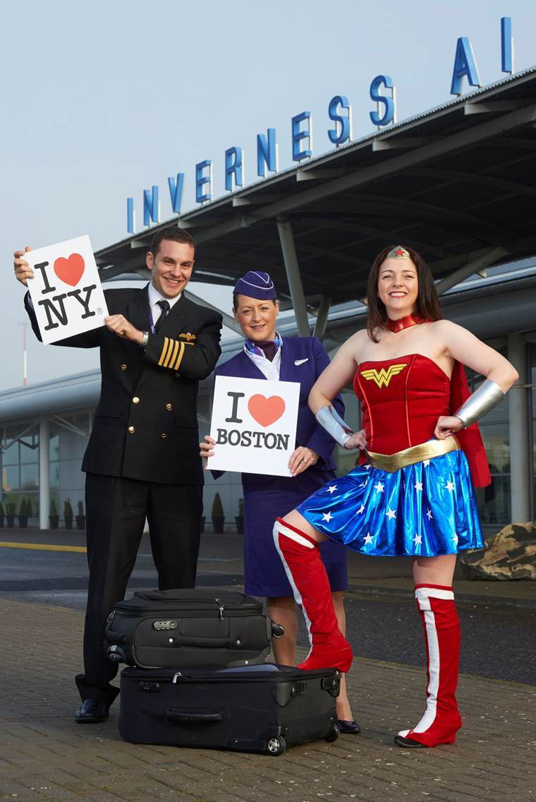 Flybe captain Tom Ross and senior cabin attendant Nicola Jansen van Rensburg pose with Wonder Woman