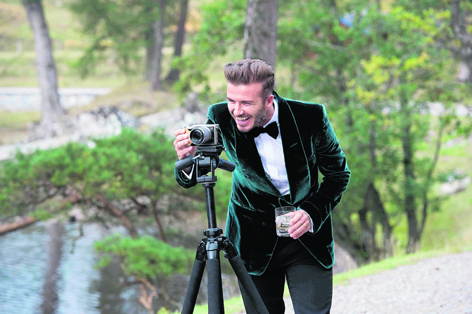 David Beckham sets up the camera whilst filming in Ross-shire