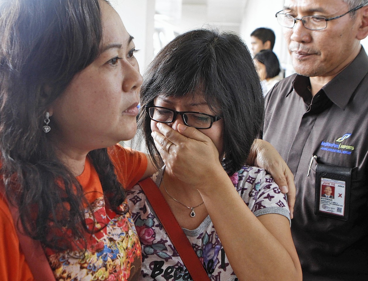 Relatives of Air Asia flight QZ8501 are waiting for the latest news on the missing jetliner at Juanda International Airport in Surabaya, East Java, Indonesia.