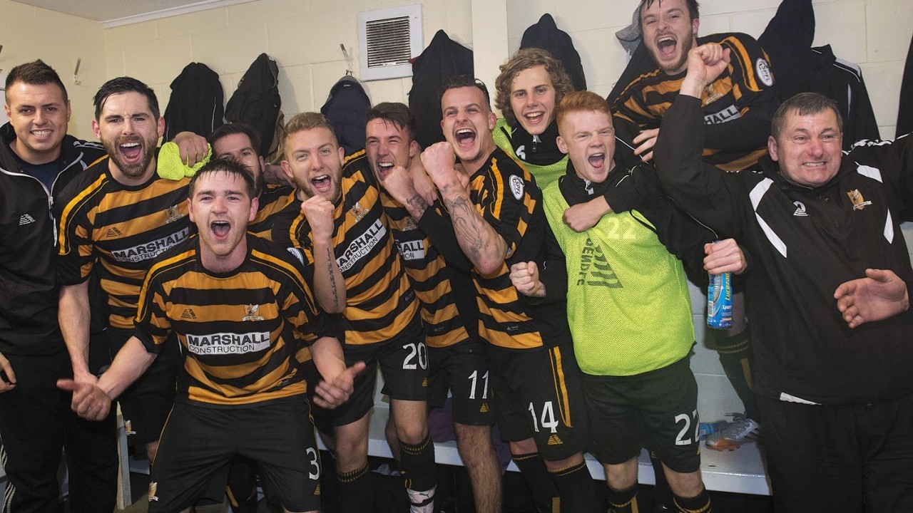 The Alloa squad celebrate back in the changing room