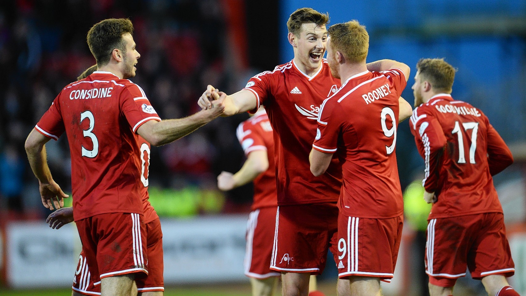 Ash Taylor celebrates his opening goal with Andrew Considine, Adam Rooney and David Goodwillie.