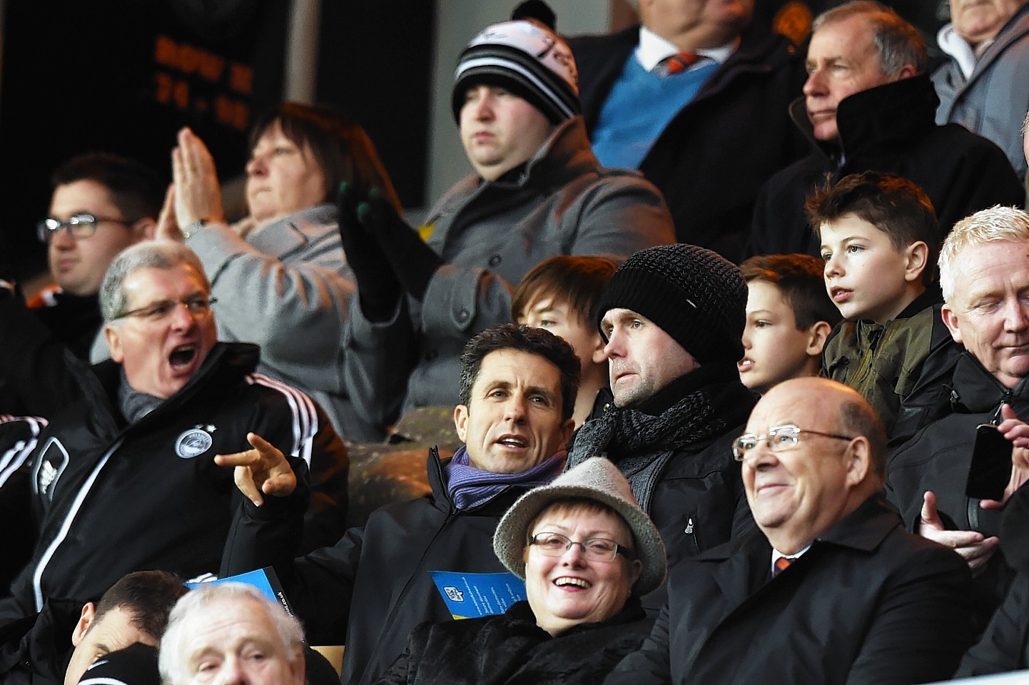 Celtic boss Ronny Deila and his assistant John Collins take in the game from the Tannadice stands.