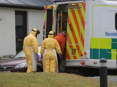 Medics escort her into ambulance