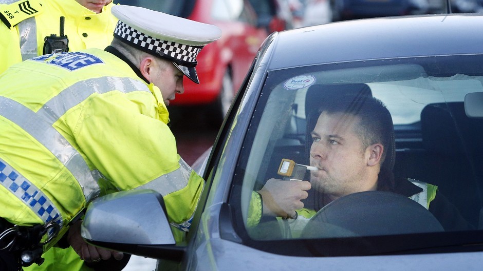 Police stop drivers in Glasgow as part of the annual festive drink-drive campaign, as a stricter drink-drive limit has come into force today in Scotland, making it lower than the rest of the UK