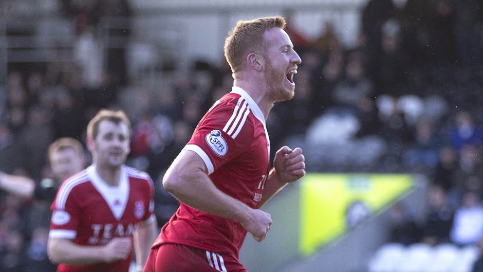 Aberdeen's Adam Rooney, left, was flying high against Dundee Utd with two goals