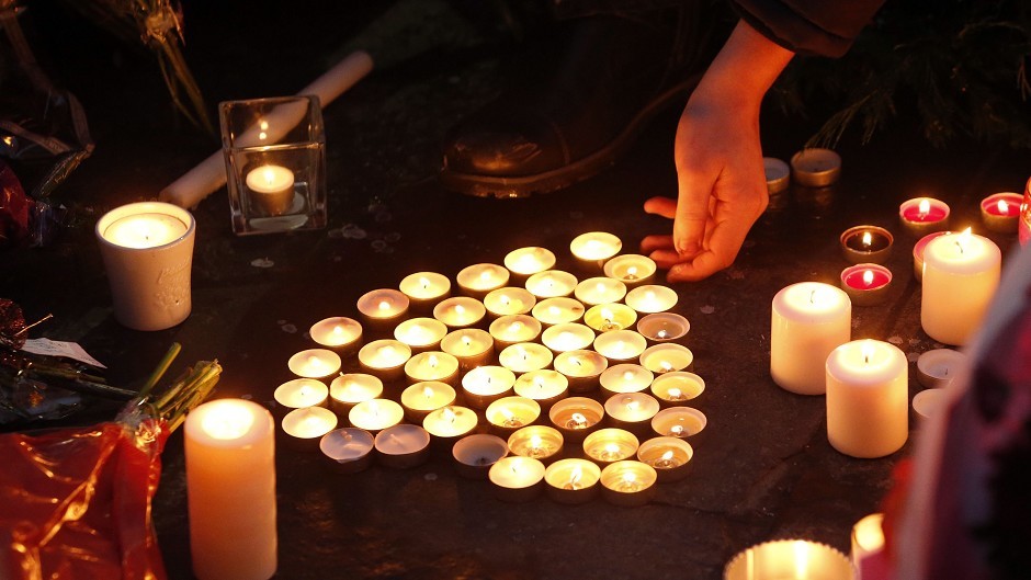 Candles are lit in Royal Exchange Square, Glasgow, to remember the victims of the bin lorry crash