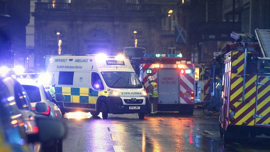 Emergency services deal with the aftermath of the crash in Glasgow.