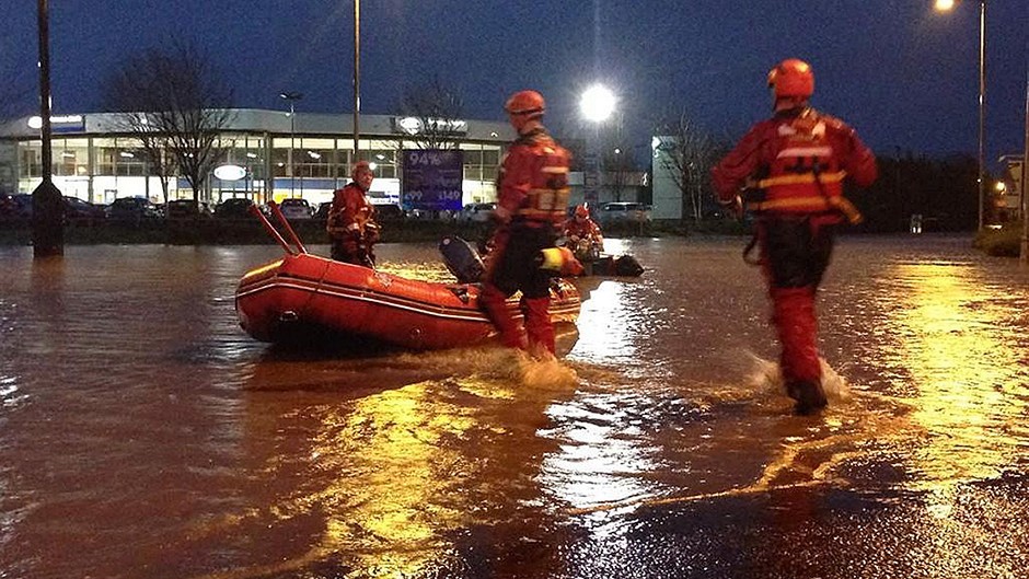 Emergency services helping stranded people at an Asda supermarket in Kilmarnock, after the River Irvine burst its banks (@AyrshireEPolice/PA)