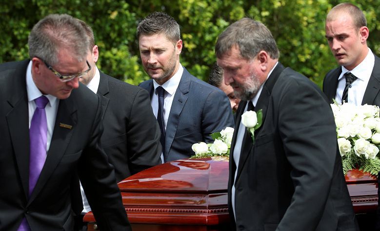 Phillip's father helps to carry his coffin