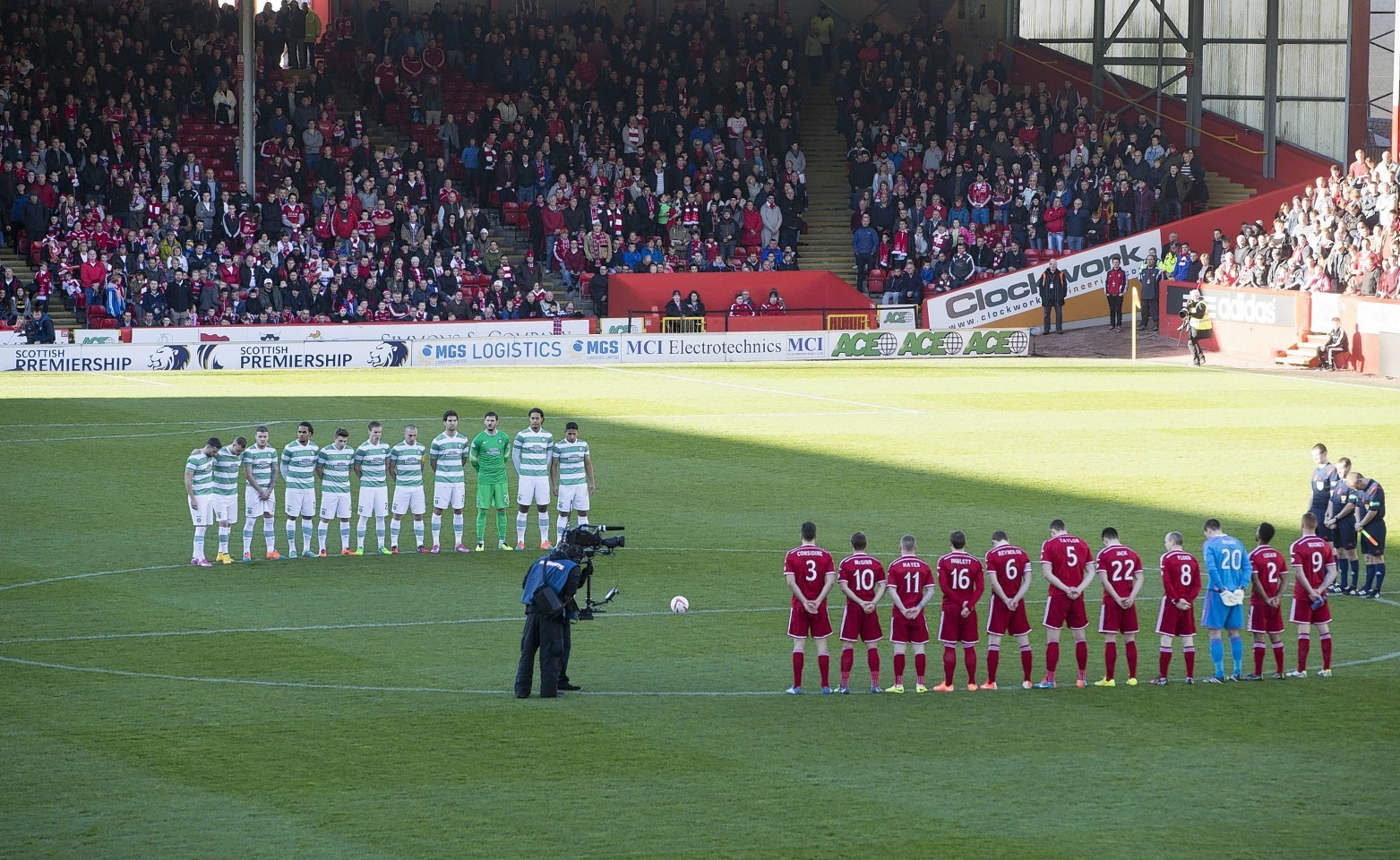 The players paid their respects before the match.