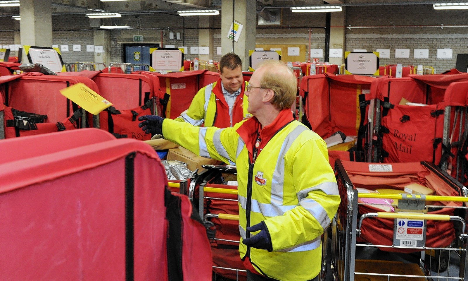 Royal Mail in Aberdeen sorting cards and parcels on the busiest day of the year for the organisation