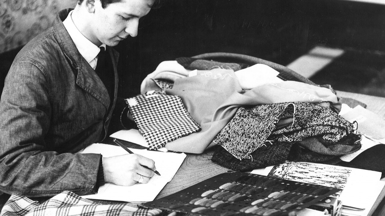 Mr A Garrick works on his garments. 1965.