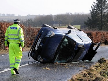 The car on its side on the A974