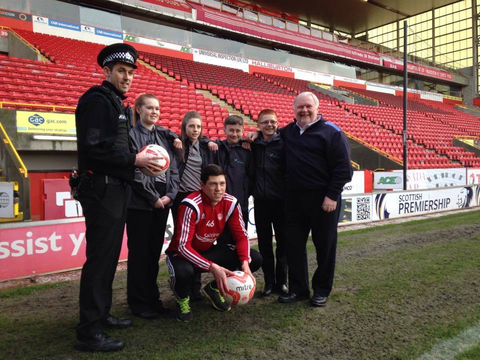 PC Kevin Lynch, youngsters from Northfield Academy and Dons legend Joey Harper launch the Aaron Williams Foortbal Tournament
