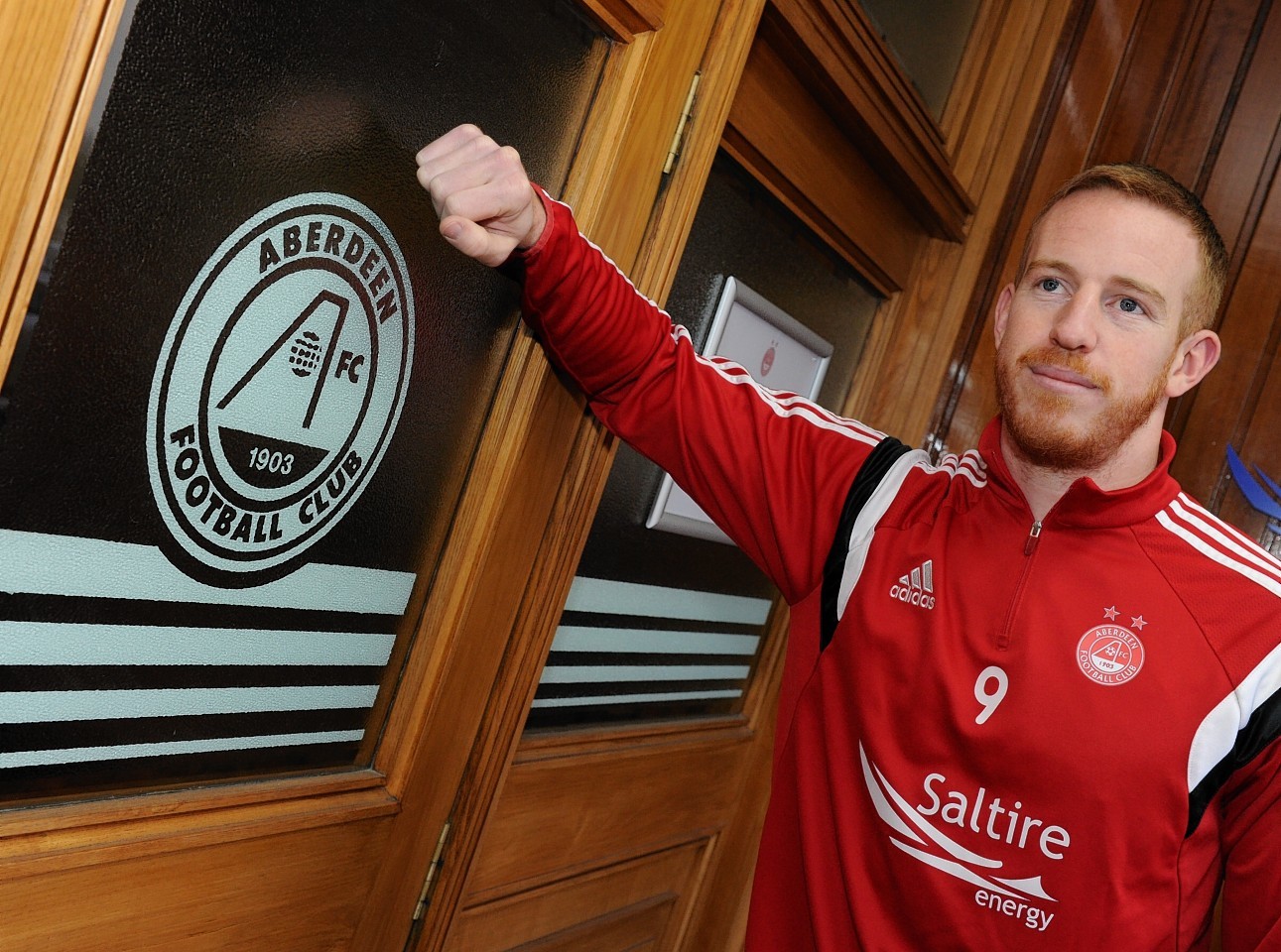 Adam Rooney fires the Dons ahead
