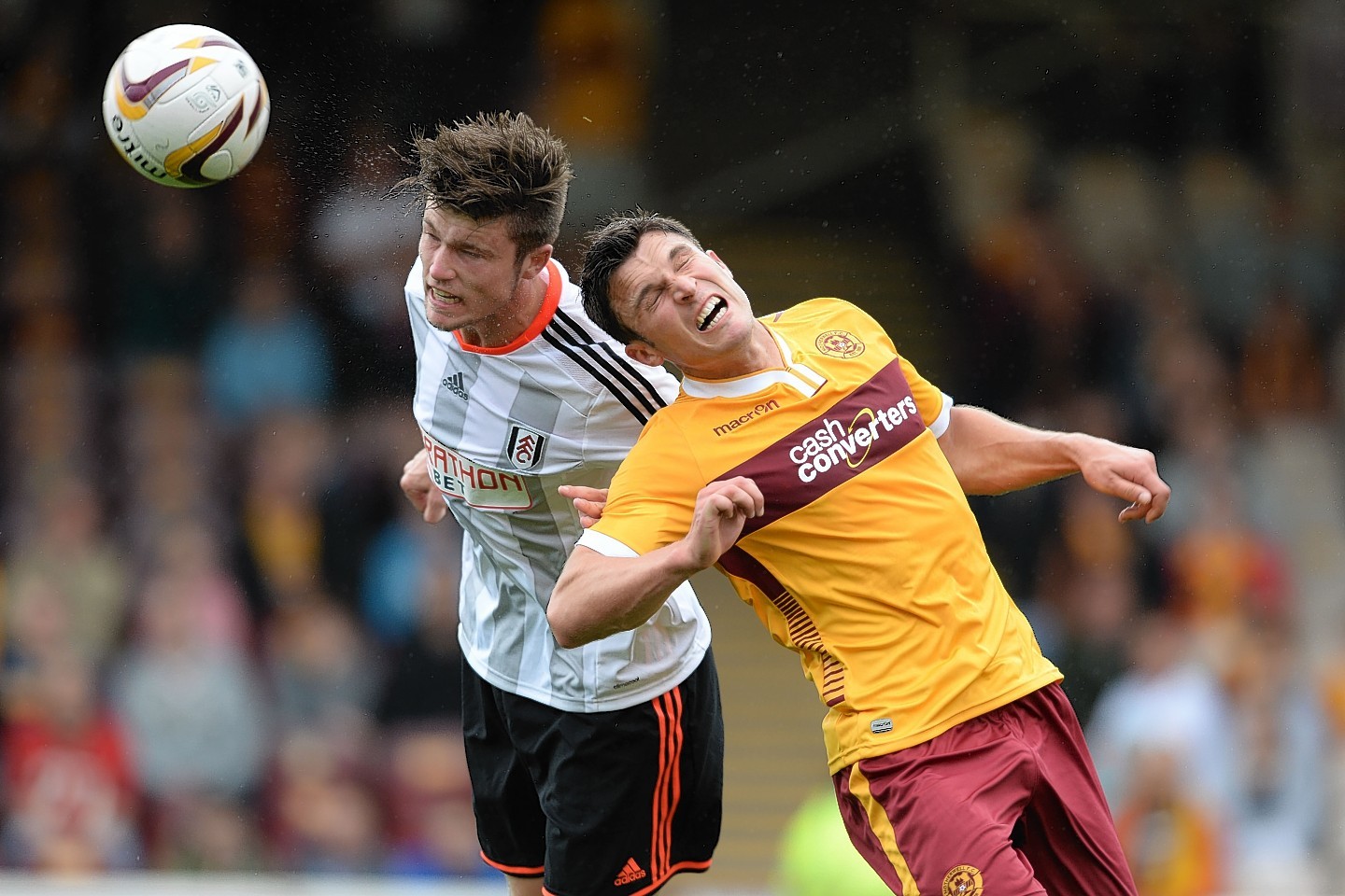 Cameron Burgess beats Motherwell's John Sutton to a header in a pre-season friendly