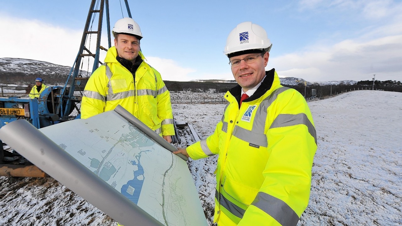 Scottish Government Transport Minister Derek Mackay checks out the plans with Peter Ritchie, Project Manager.