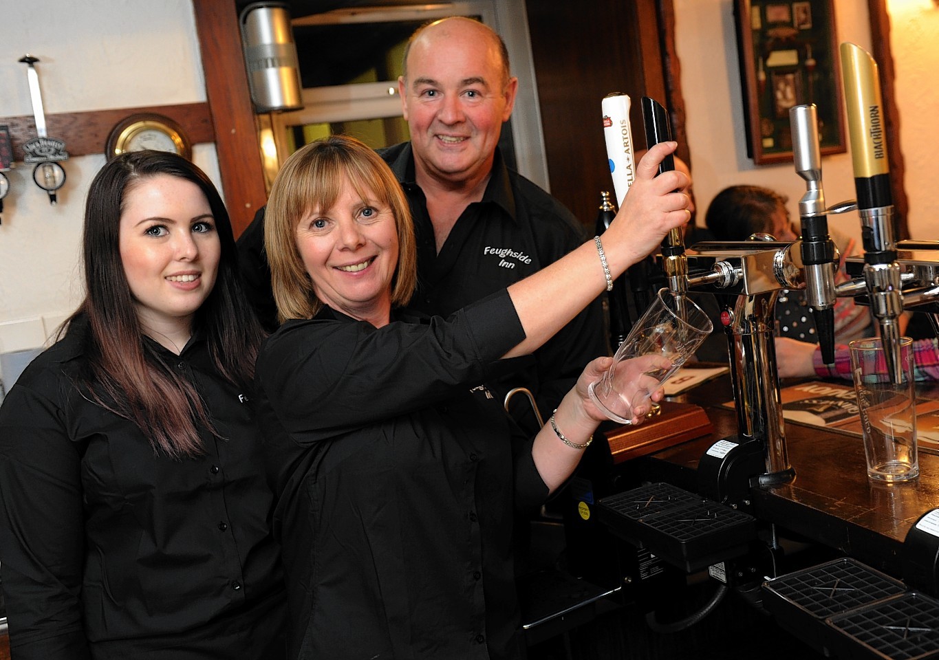 The Feughside Inn reopened following a two year closure last night. Pictured are new owners, Catherine, Donald and Jodie Callander. Credit:  Kenny Elrick.