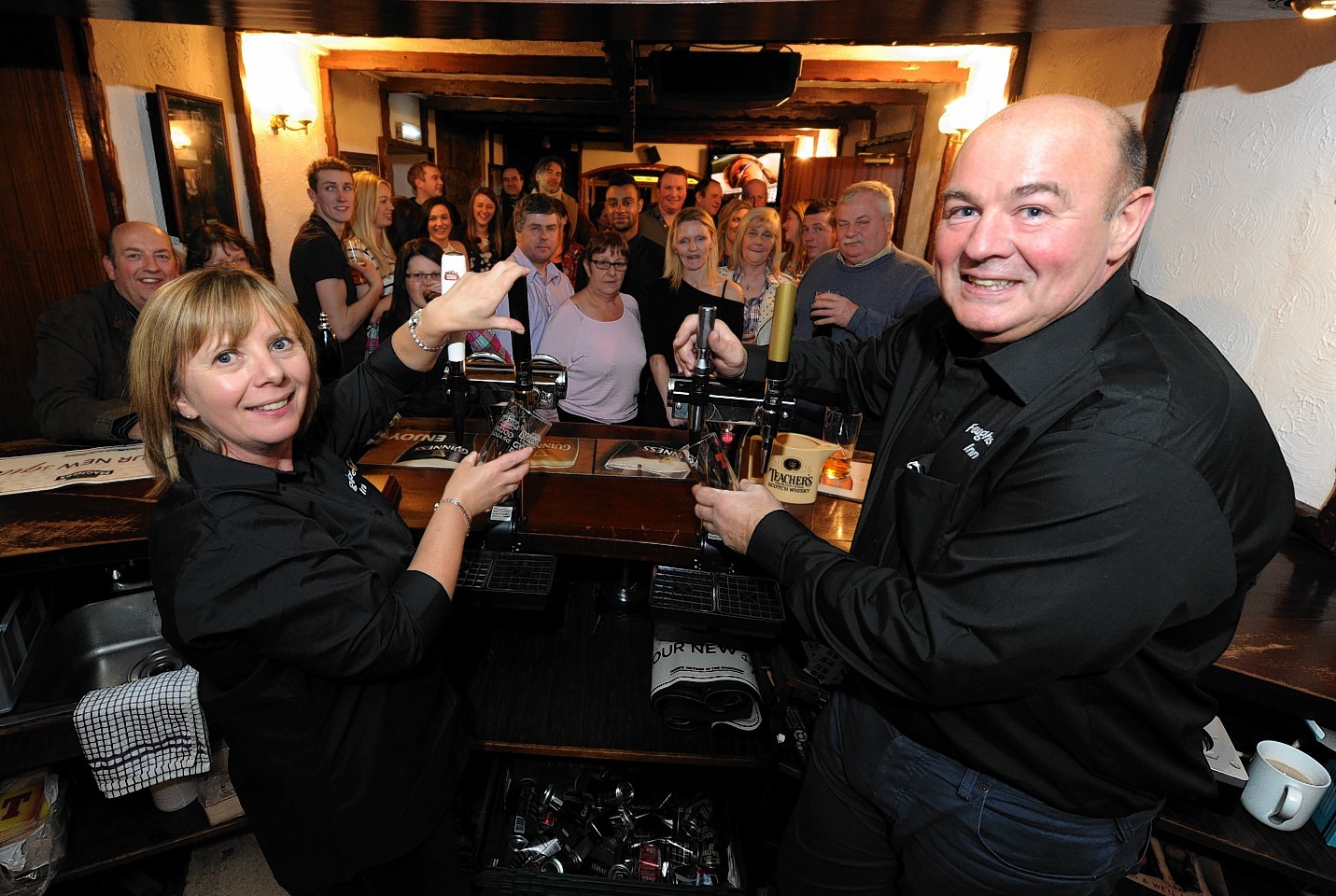 The Feughside Inn reopened following a two year closure last night. Pictured are new owners, Catherine and Donald Callander. Credit:  Kenny Elrick.