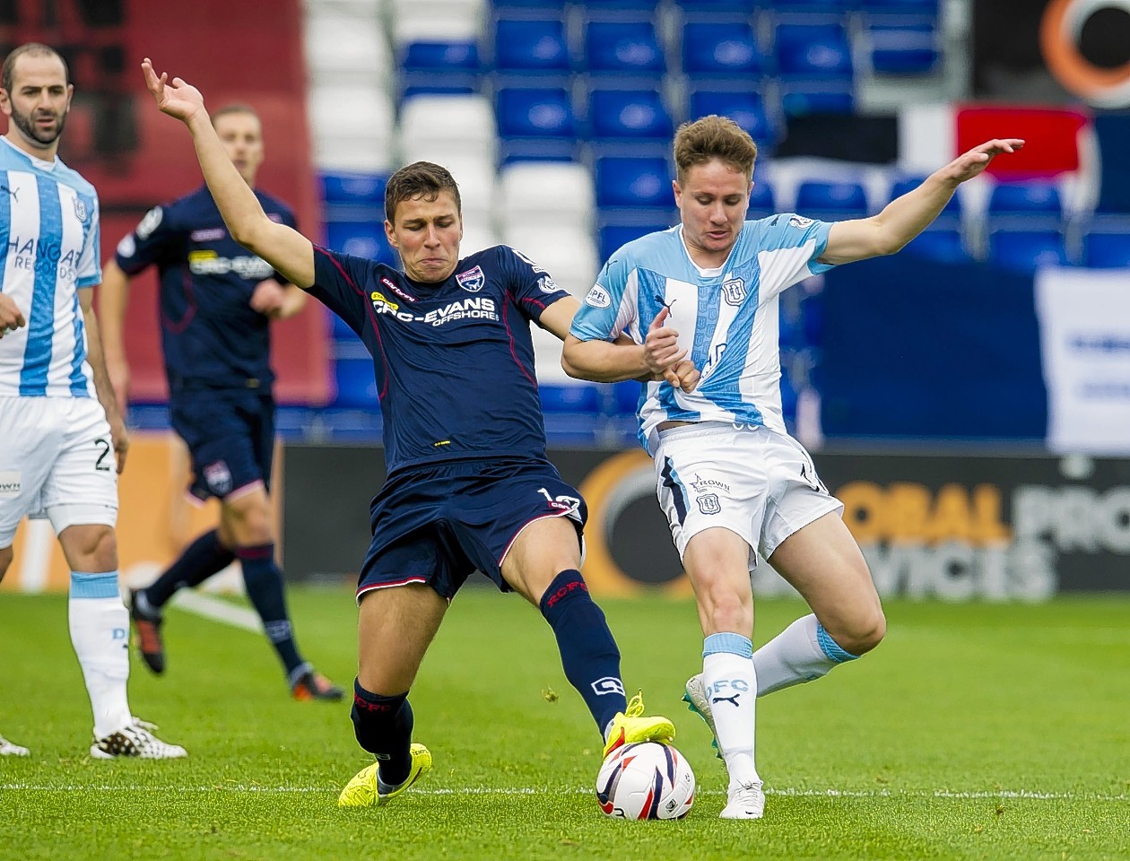 Kiss challenges Dundee's Simon Ferry earlier this season. 