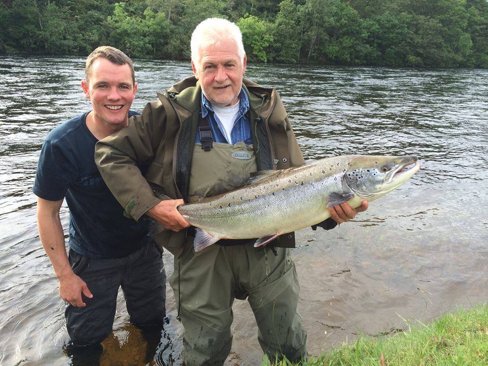 Ghillie Ryan Rutherford and angler Eric Craig with a 20lb salmon caught and released at Ness-side on the River Ness