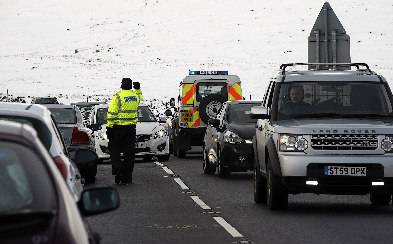 Cars line the busy A82 at Glencoe Mountain Resort yesterday