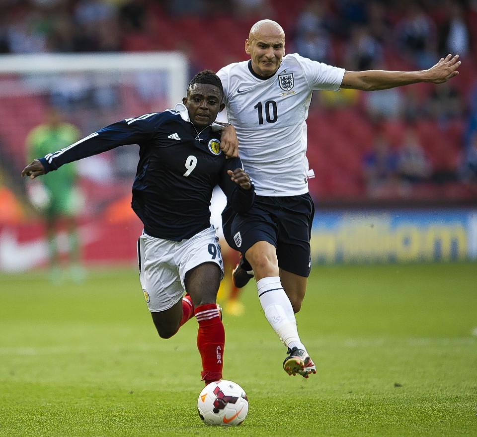 Islam Feruz, pictured playing for Scotland under-21s against England's Jonjo Shelvey has joined Blackpool on loan from Chelsea