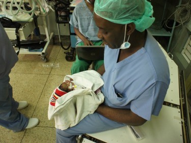 Dr John Sekabira with one of his precious patients