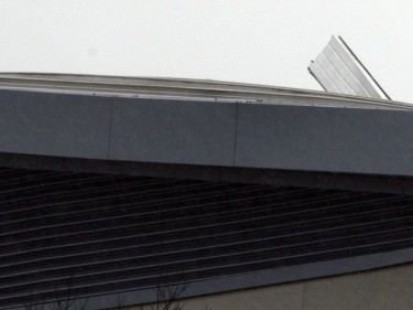 A metal roof panel flaps about in the wind at Lochaber High School.