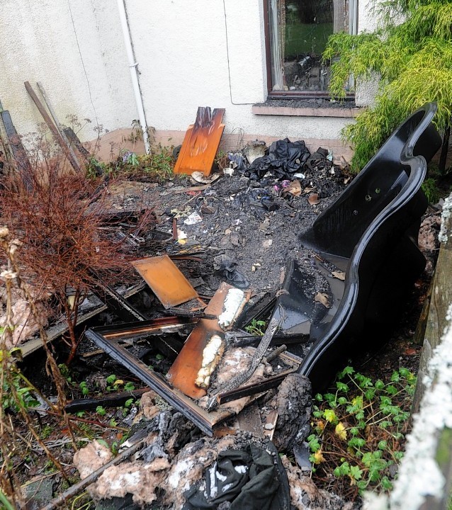 Charred remains of the interior of the house in Lochend