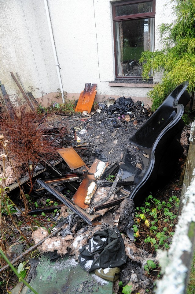 Charred remains of the interior of the house in Lochend