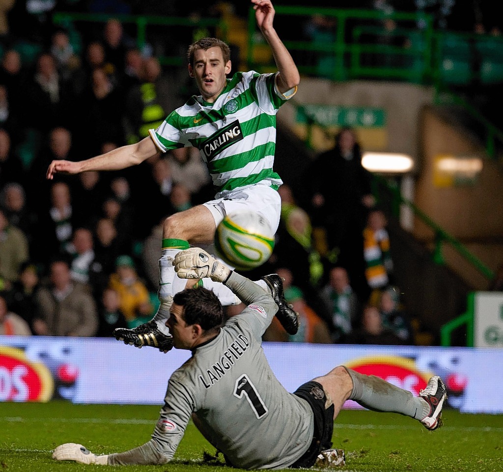 Niall McGinn chips Jamie Langfield while playing for Celtic