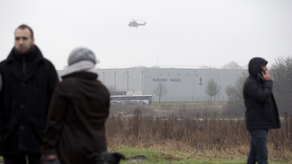 A police helicopter flies over Dammartin-en-Goele, northeast of Paris, as French security forces carried out an operation to capture suspects thought to be behind the Charlie Hebdo massacre (AP)