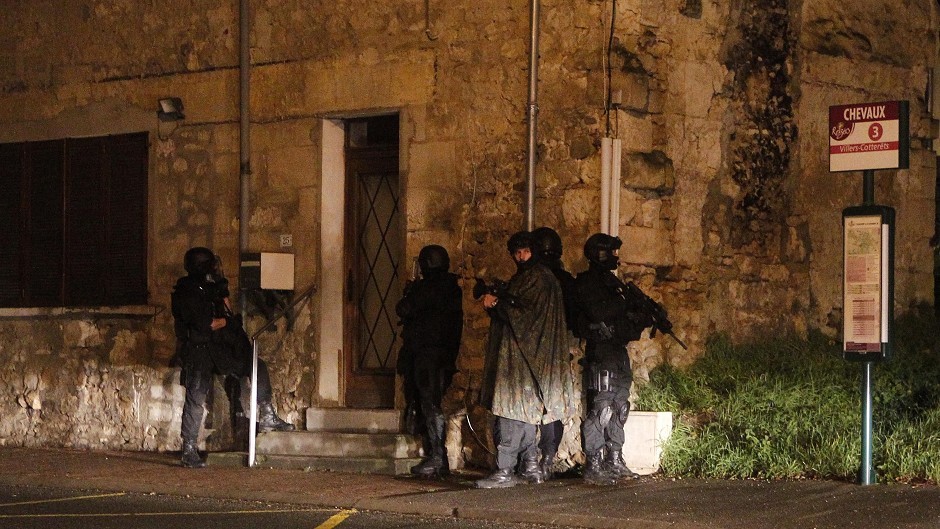 Armed police patrol the village of Fleury, north east of Paris, hunting the Paris massacre suspects (AP)
