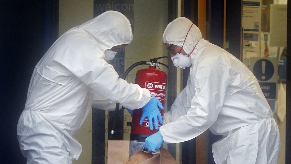 Police forensic officers took several items away for examination, including a fire extinguisher
