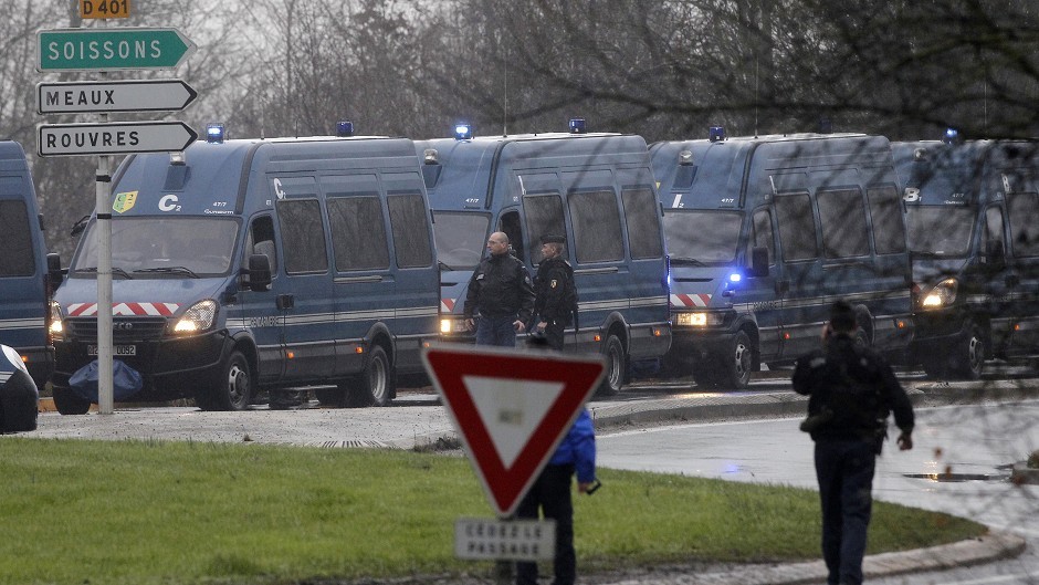 Police vans are lined up in Dammartin-en-Goele, northeast Paris, in an operation to try and capture the Charlie Hebdo massacre suspects (AP)