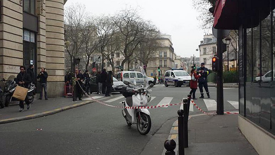 Scene outside the offices of a satirical magazine in Paris where gunmen attacked (photo taken with permission from the Twitter feed of @Lestatmp)