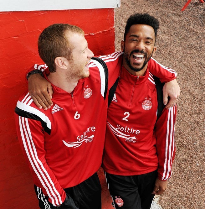 Mark Reynolds and Shay Logan will both start for the Dons but who should join them at the back?