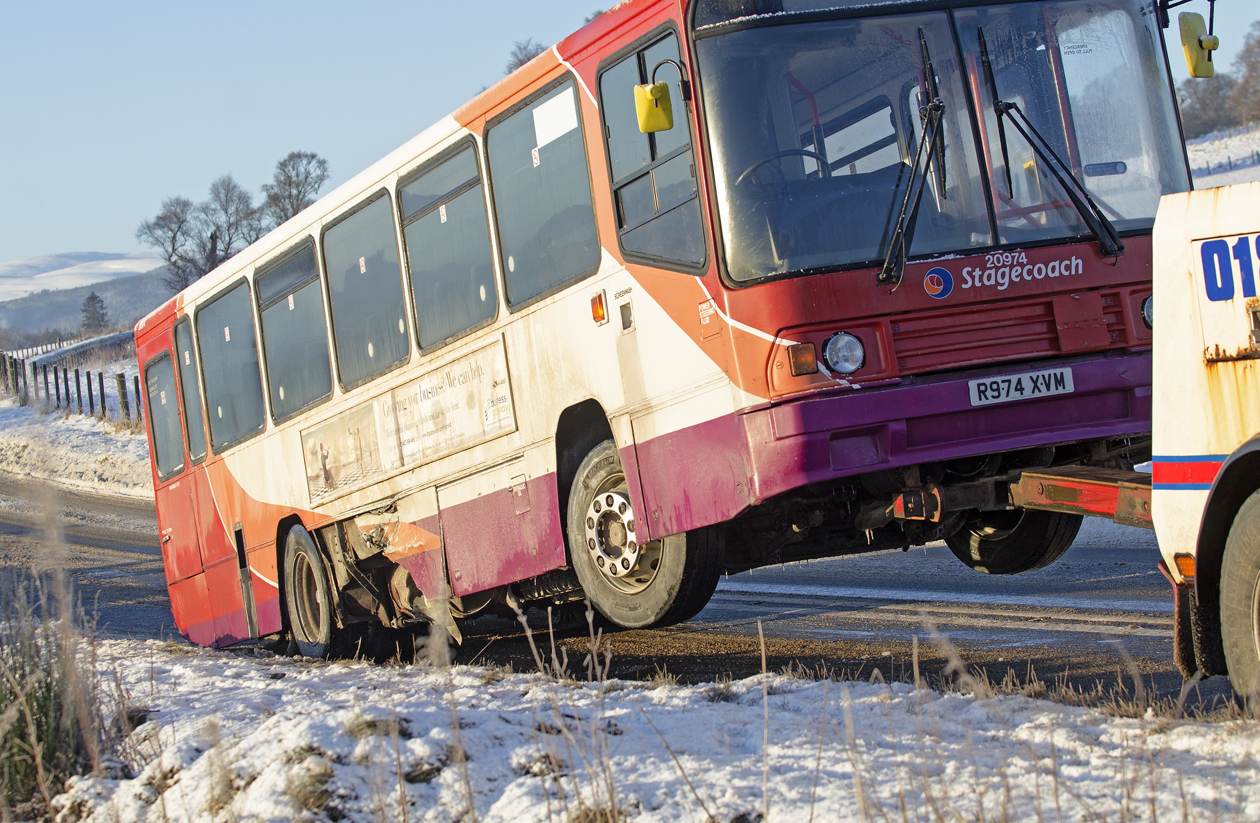 Stagecoach bus is lifted for removal from the site