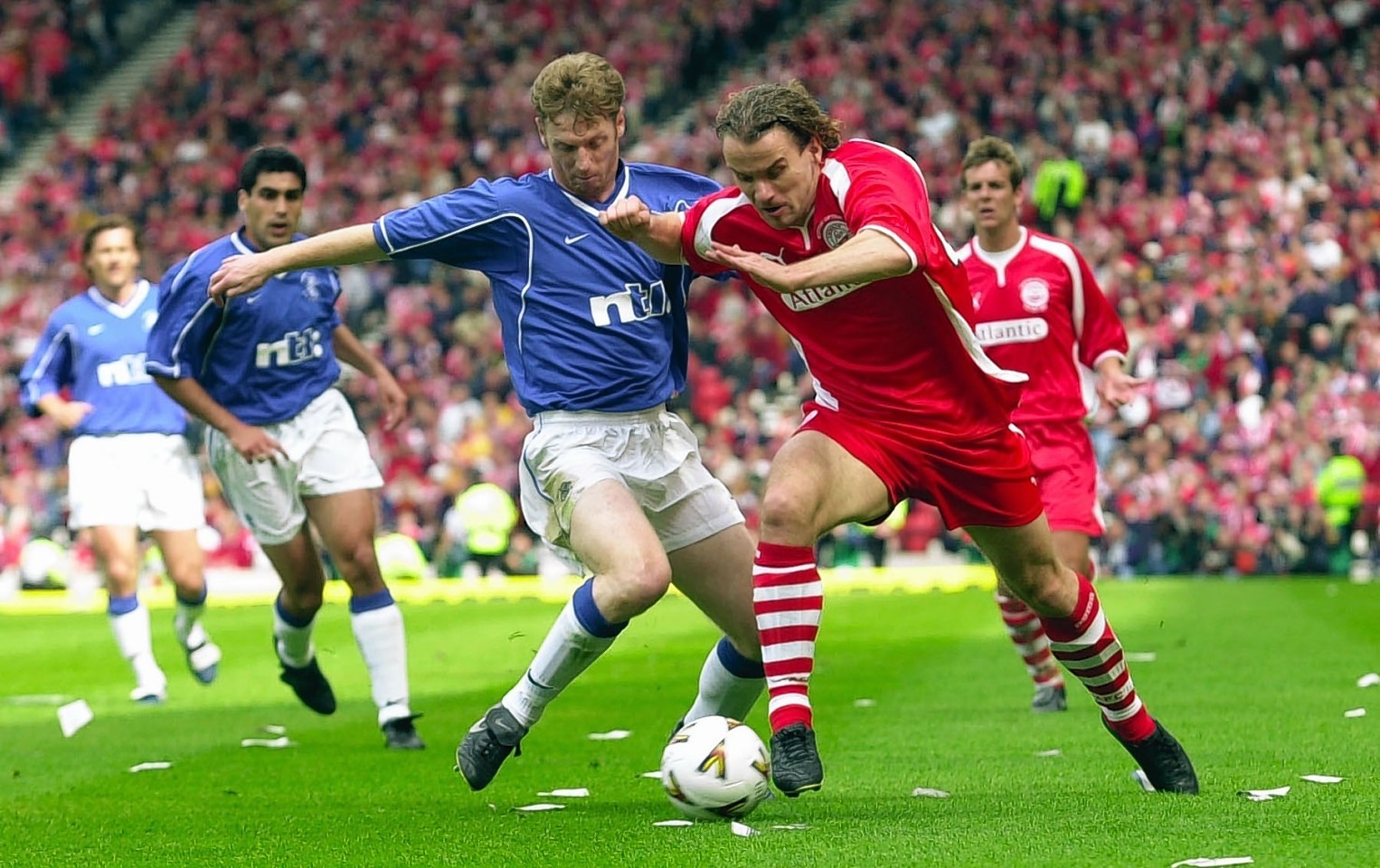 Stavrum up against Rangers deferender Craig Moore in the Scottish Cup final in 2000