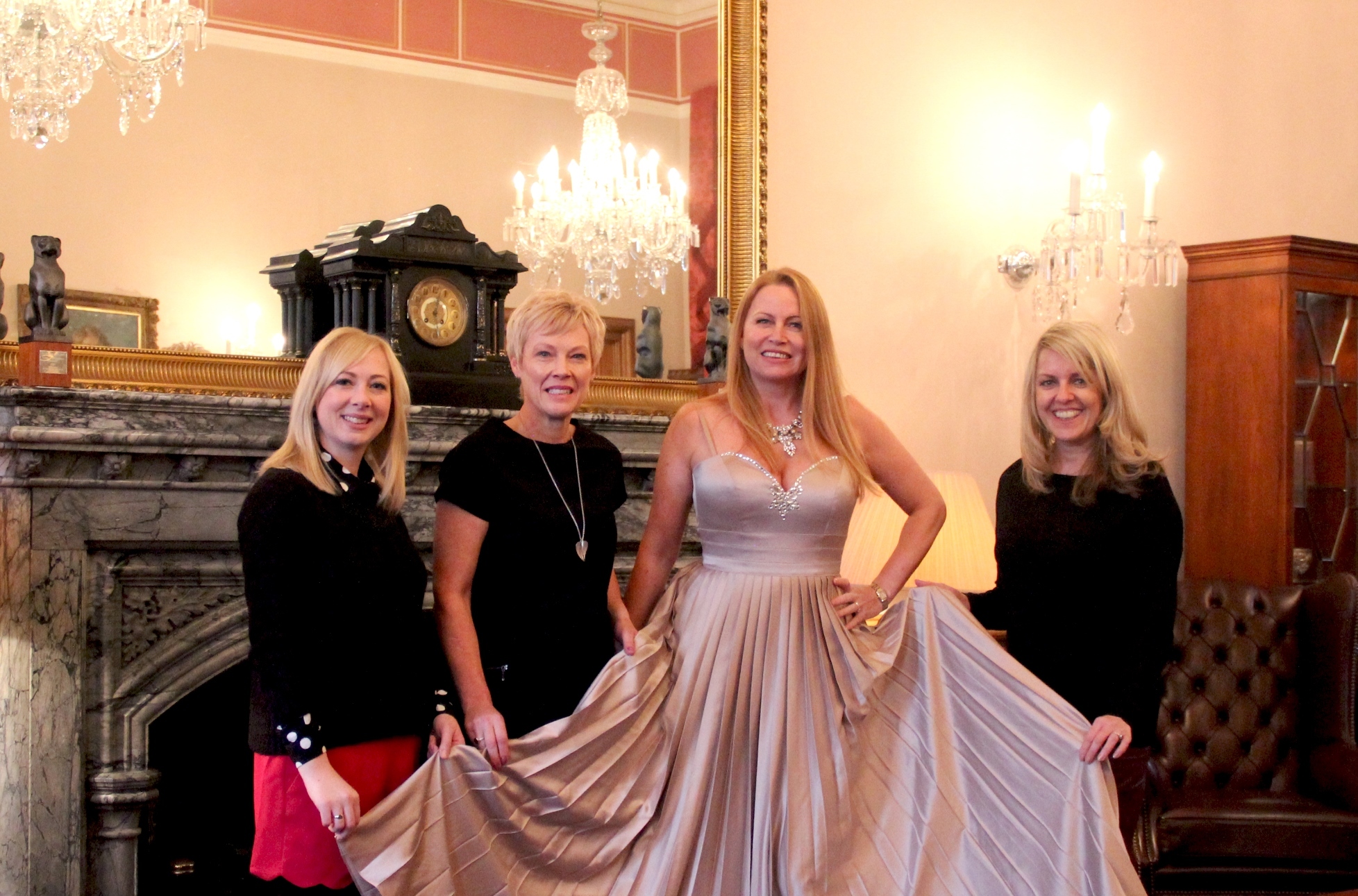 Left to right: Katie Watters, Cornerstone Fundraising Events Co-ordinator; Event organiser, Debbie Butler; Model, Dez Elliot (wearing the auction dress); and Lisa Duthie, Director of Corporate Relations & Fundraising