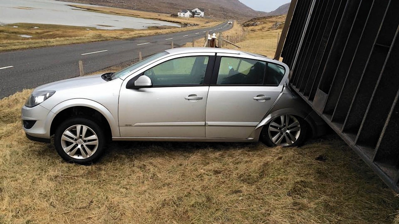 A shipping container weighing two-and-a-half tonnes crushed a car as it was blown 80ft by hurricane-force winds.